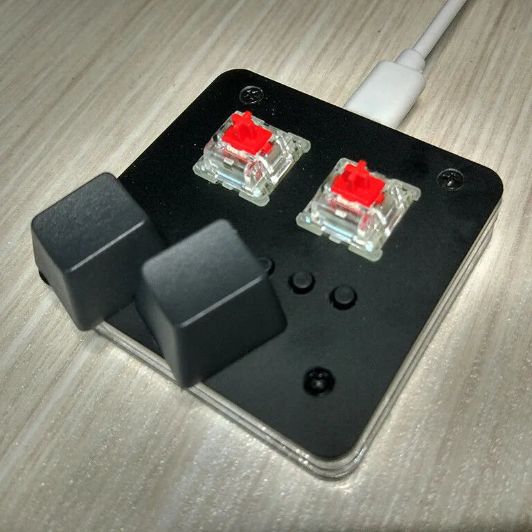 Compact white USB wired keyboard with multimedia keys and touch panel on a desk