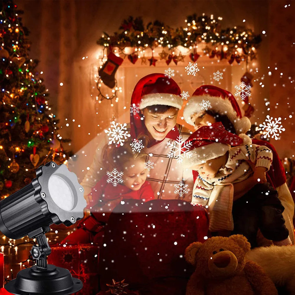 LED Christmas snowflake laser projector with white moving patterns on a dark garden wall at night