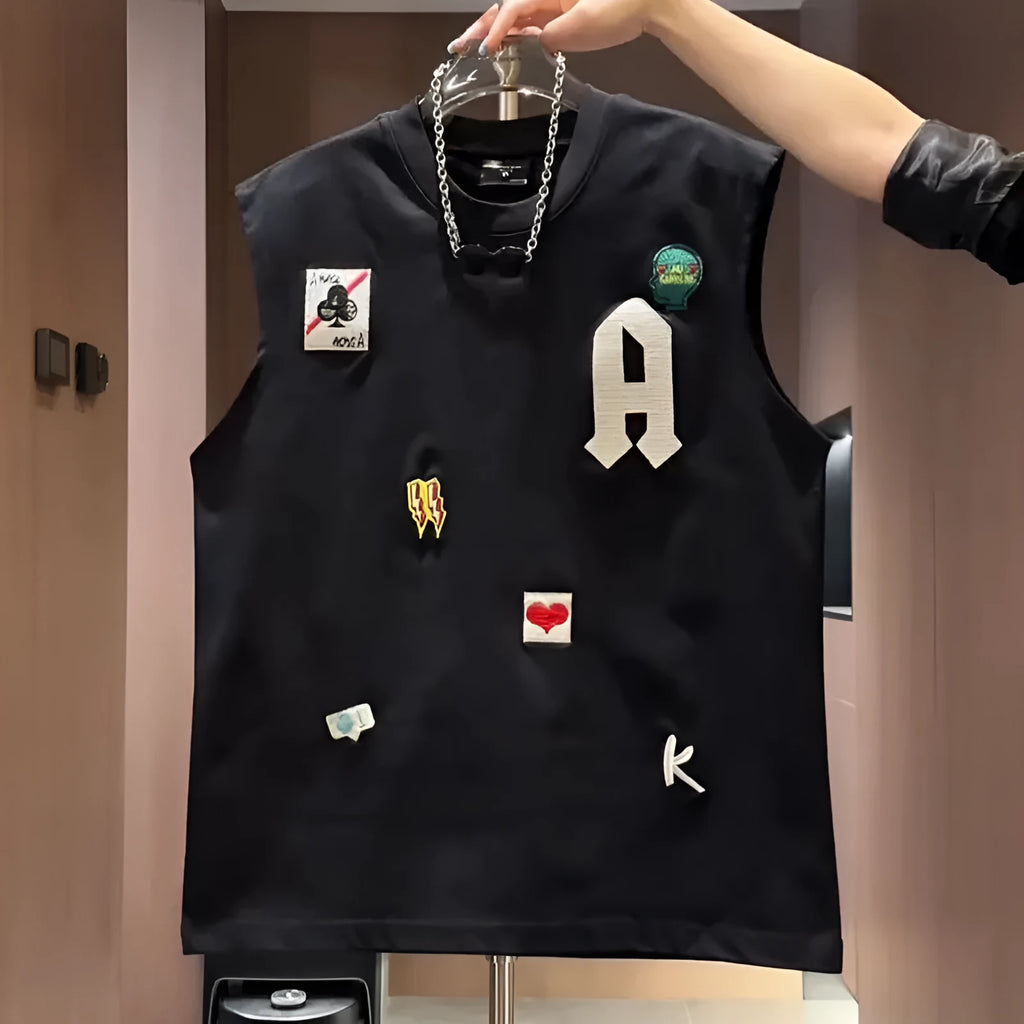 Men's black cotton sleeveless vest with a cartoon graphic print, laid flat.
