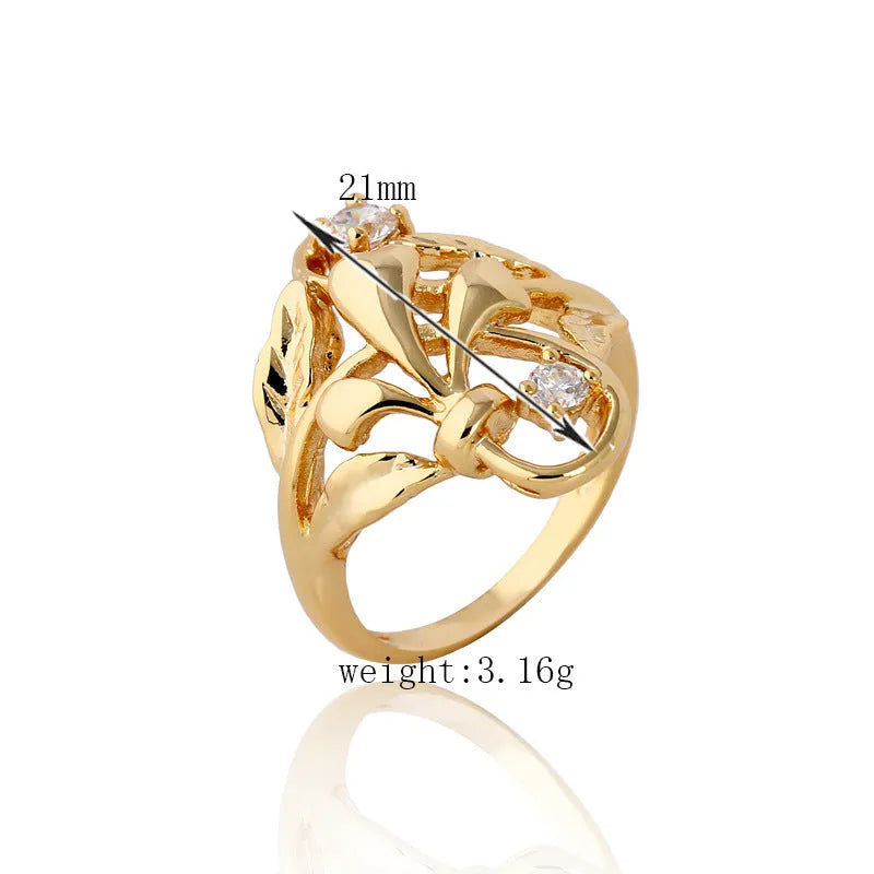 Gold tone copper ring with exaggerated irregular leaf design and white zircon stones, women's geometric band ring