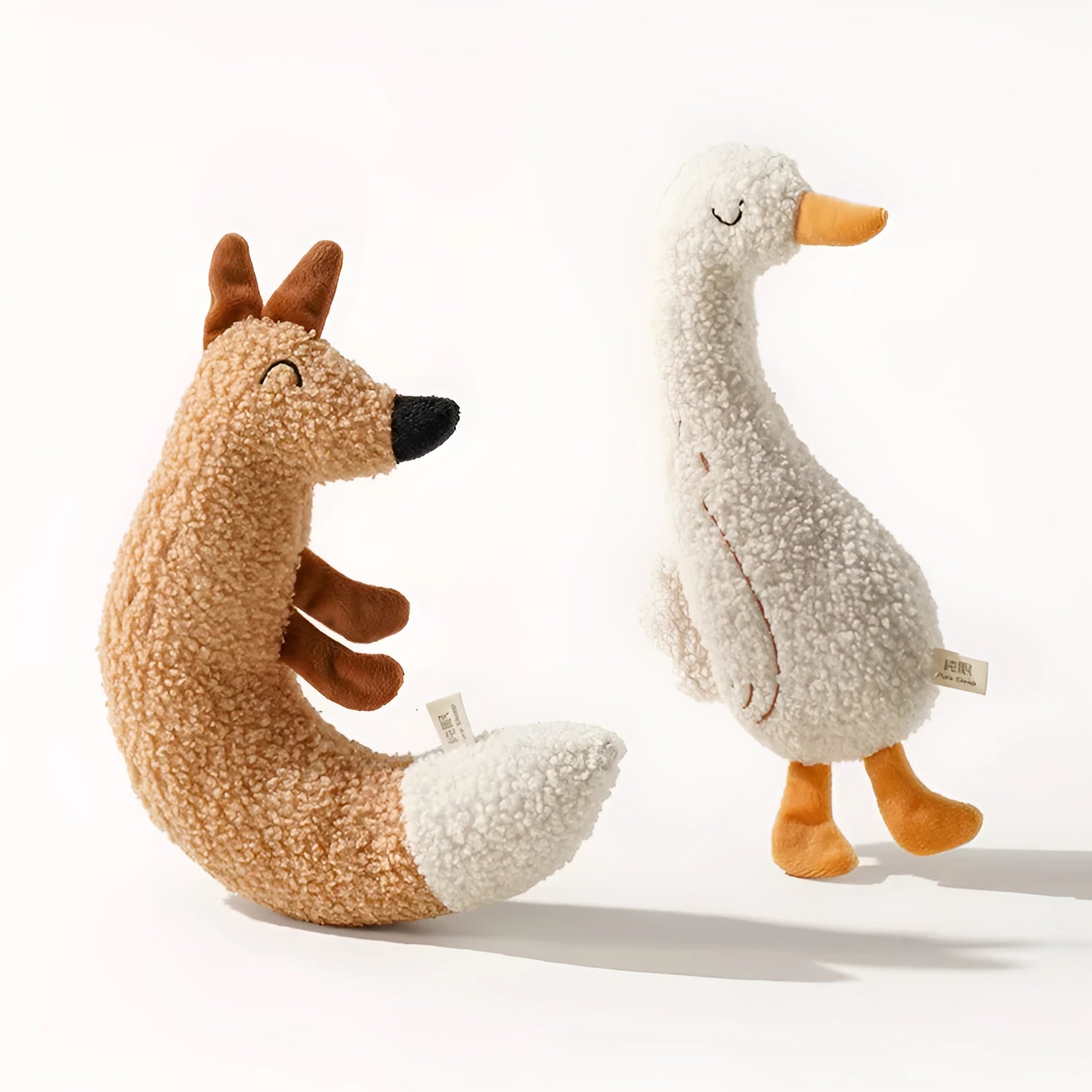 Cartoon dog chew toy in fox or duckling design with crinkle sound feature