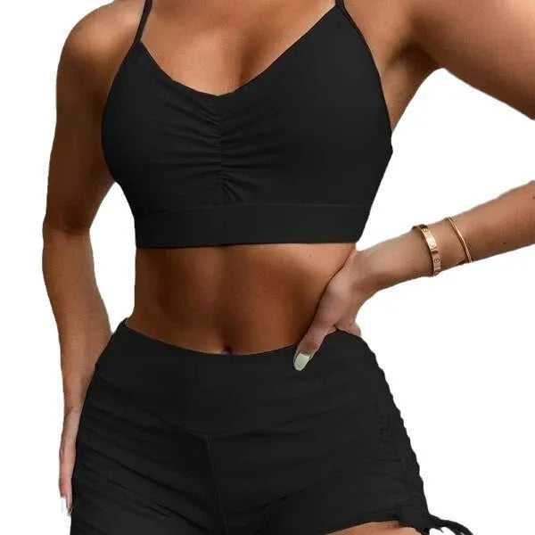 Women's black high-waist bikini swimsuit with split-side shorts and brief top.