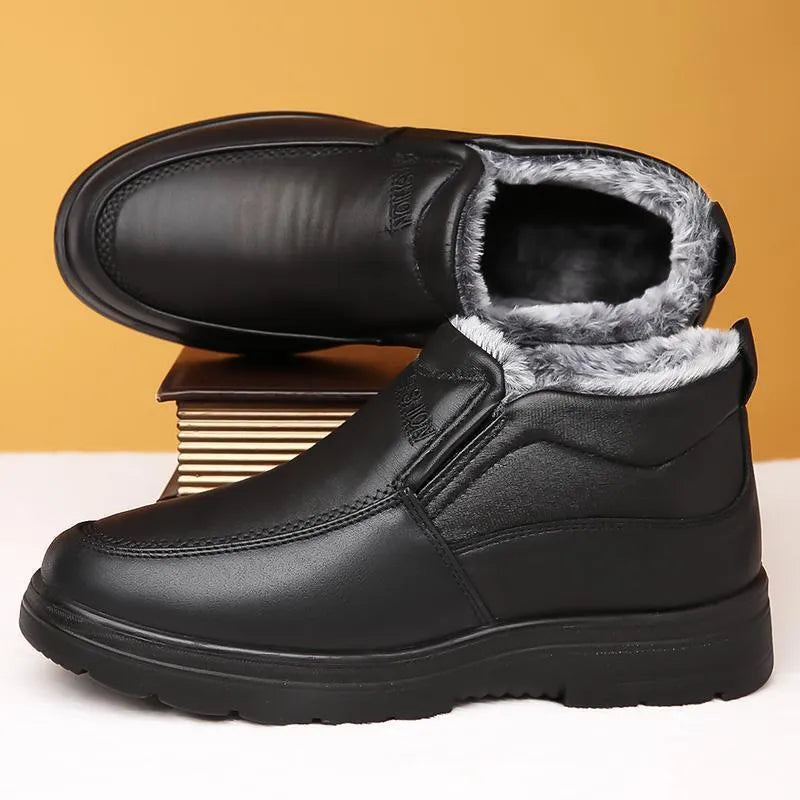 Men's black fleece-lined winter slip-on shoe with a non-slip rubber sole, shown on a size 45 foot.