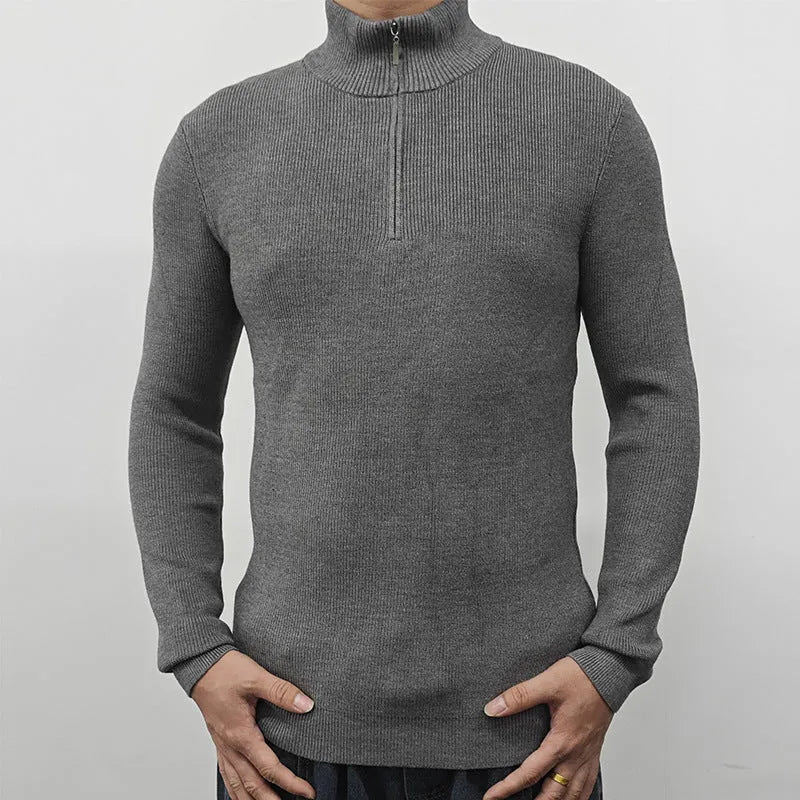 Men's black half-turtleneck zipper sweater with long sleeves on a grey background