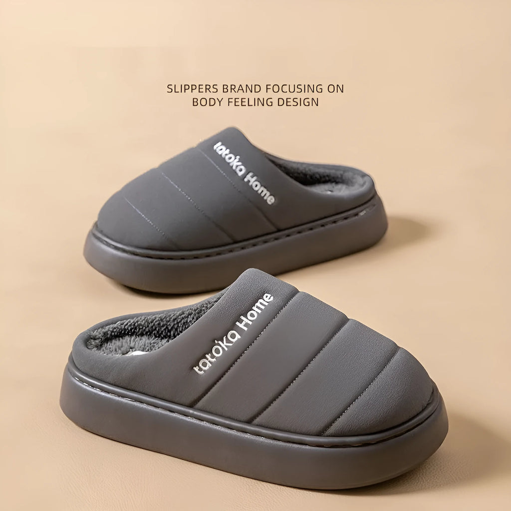 Pair of khaki fleece-lined cotton slippers with round toe and flat platform sole