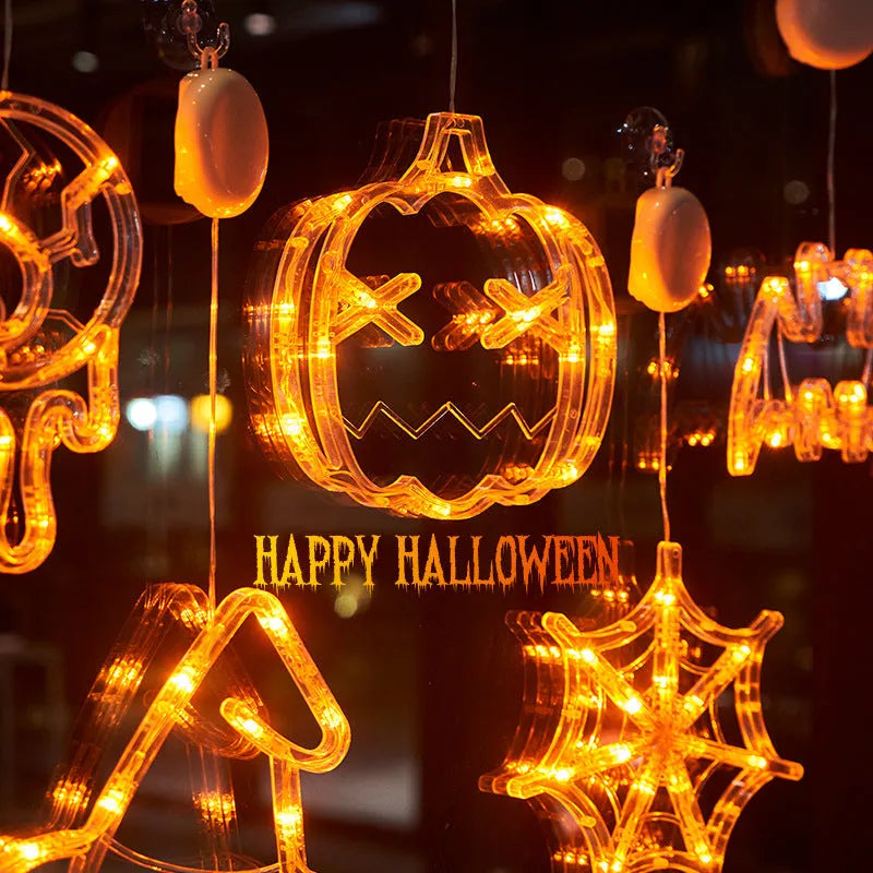 Halloween window hanging LED lights with spider and pumpkin decorations creating horror atmosphere lighting