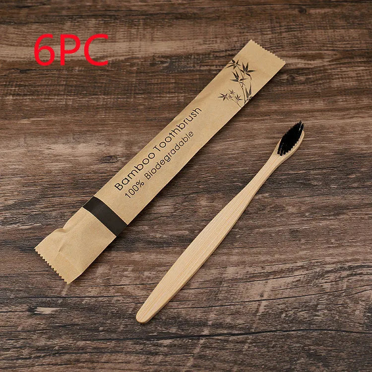 10 bamboo toothbrushes with coloured handles and charcoal bristles displayed together