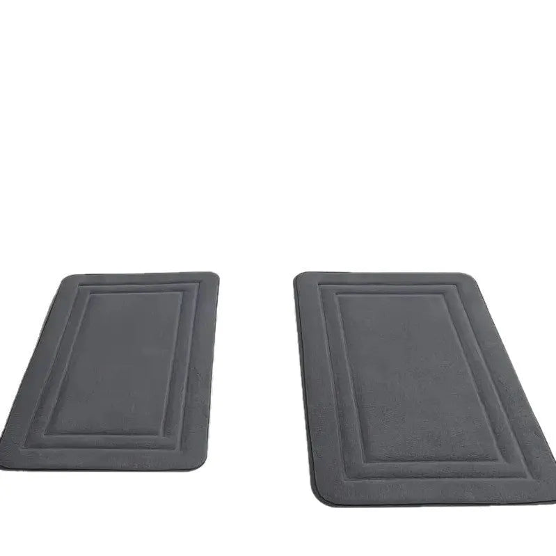 Three-piece PVC bathroom floor mat set in grey with striped and grid patterns on tiled floor