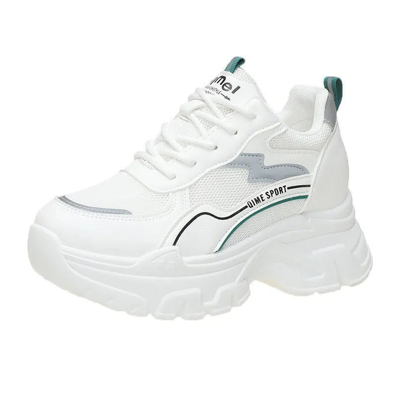 Women's white low-top sports dad shoes with cross strap and round toe, showcasing breathable mesh design.