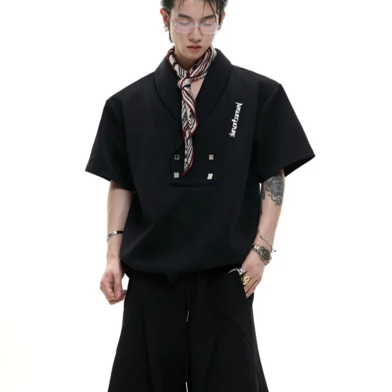 Men's dark grey V-neck padded shoulder sports suit with metal embellishments and matching shorts