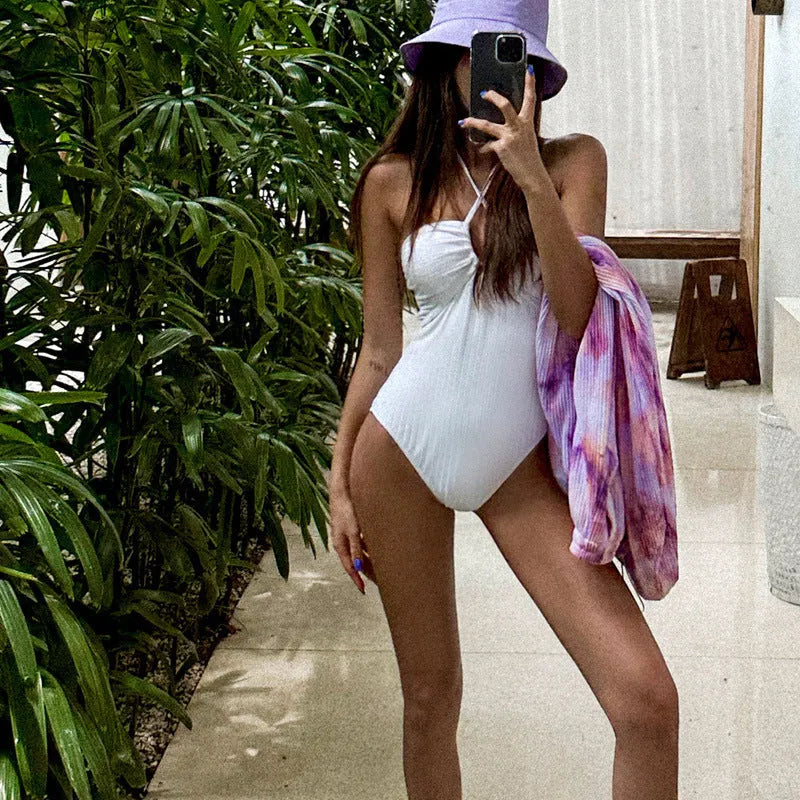 White hollow-out one-piece swimsuit for women with backless belly covering design