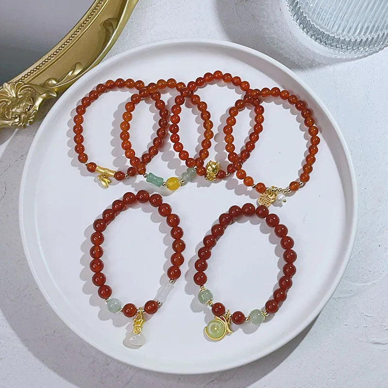 Handmade red agate bracelet with Chinese dragon design for women.