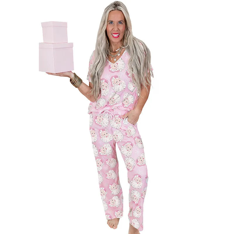 Women's pink Christmas print top and trousers set, short sleeve top, full length trousers, polyester, sizes S-XL.