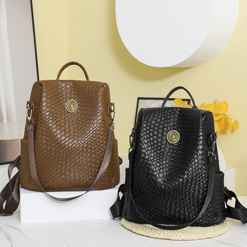 Women's anti-theft backpack in black PU material with multiple compartments and urban styling