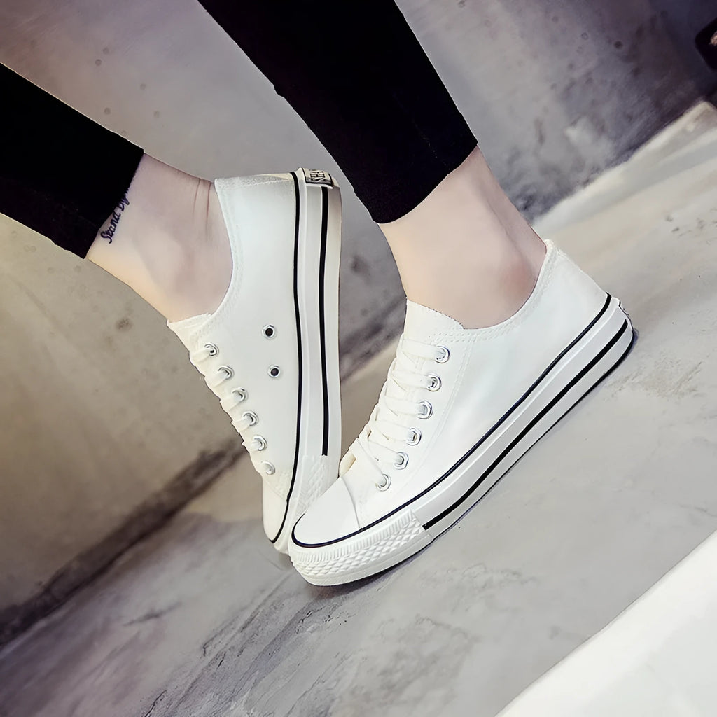 Women's solid colour canvas casual shoes in black, white black, white red and all black colour options.