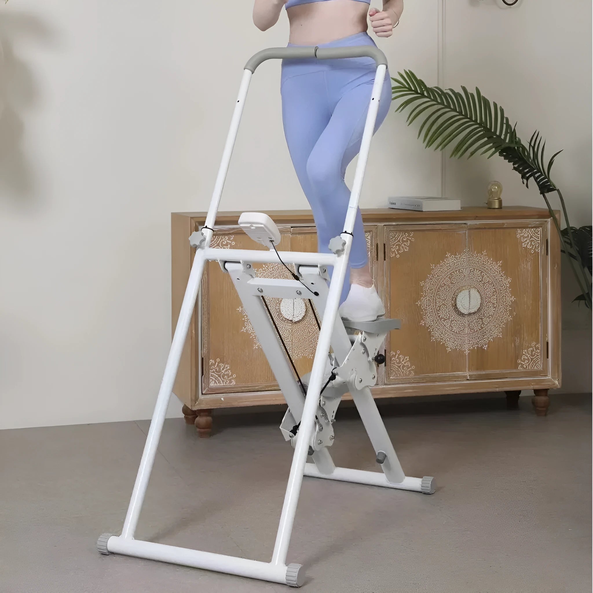 Foldable white home treadmill with climbing frame in unfolded position for indoor exercise