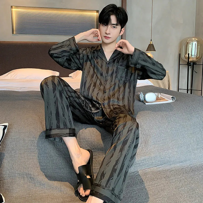 Men's black striped ice silk V-neck pyjama set with long sleeves and trousers.