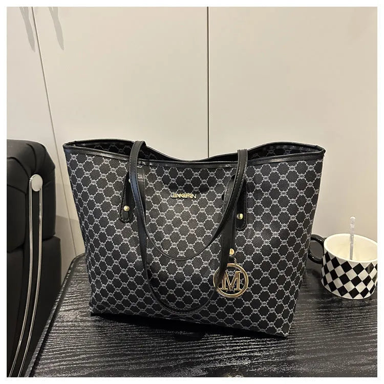 Street style PU shoulder bag with adjustable strap in black colour showing sewing thread detail