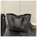 Street style PU shoulder bag with adjustable strap in black colour showing sewing thread detail