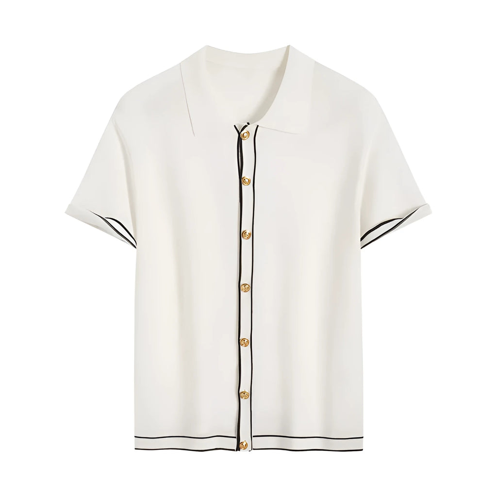 White women's short sleeve cardigan with dark contrast lapels laid flat.