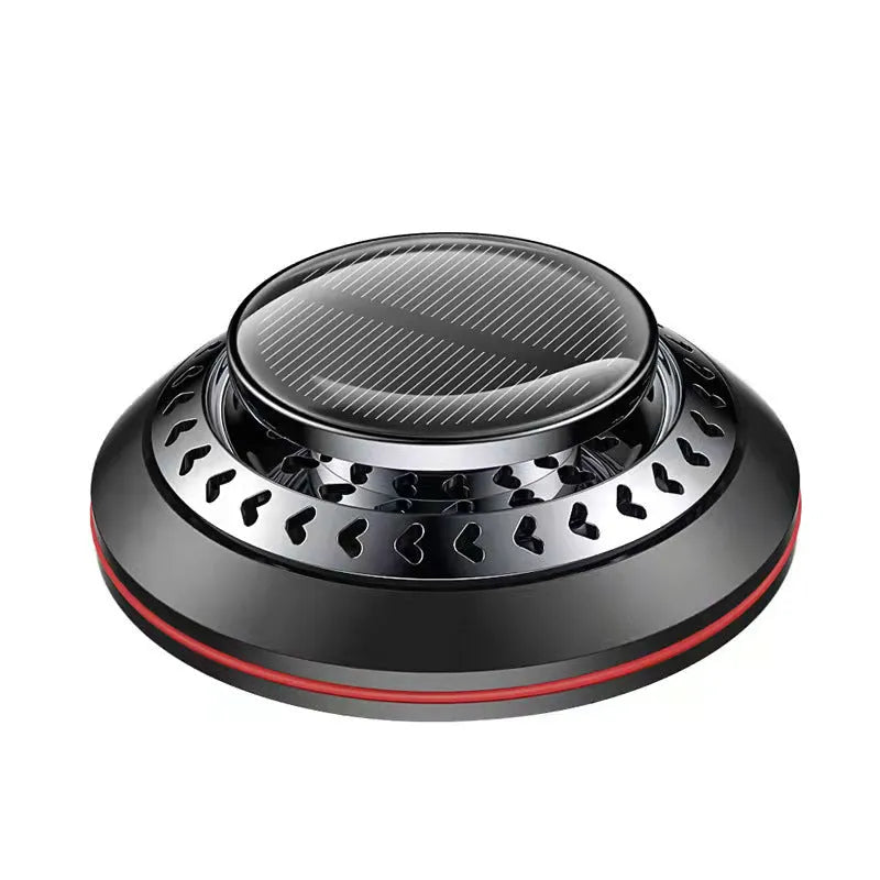 Solar-powered aluminium car air purifier and essential oil diffuser unit on a car dashboard