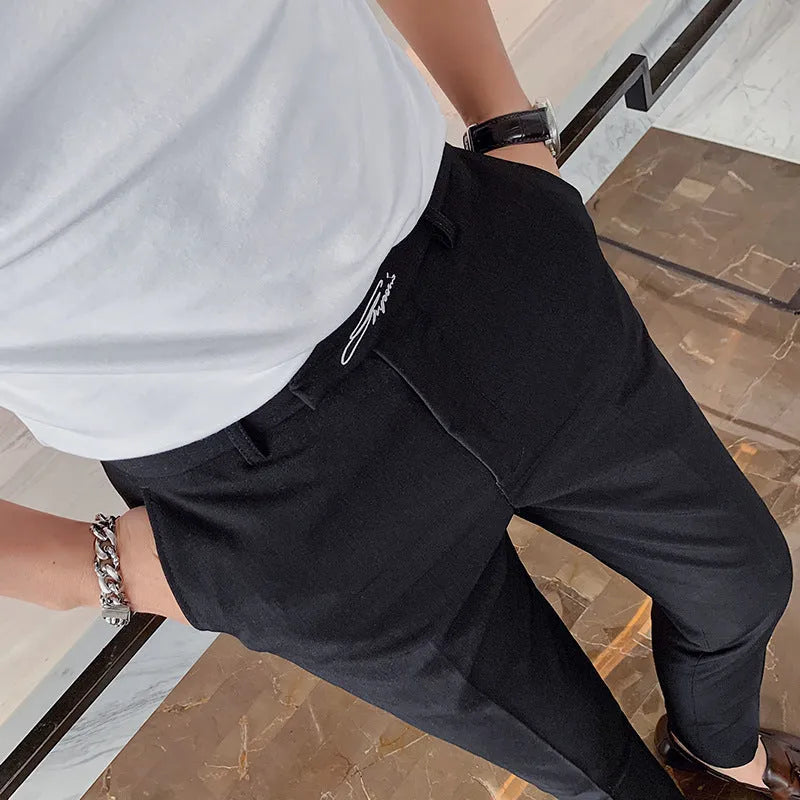 Cotton blended men's slim casual straight leg trousers in black, side view