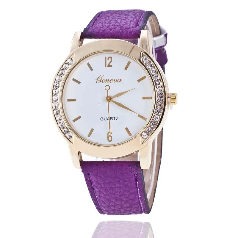 Geneva women's quartz watch with blue dial, round alloy case, and imitation leather strap on display