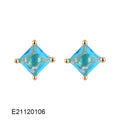 Gold-plated drop earrings with pear-shaped candy-coloured zircon stones on a white background.