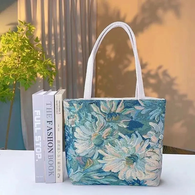 Double-sided embroidered canvas bag with gold wire detailing showing botanical pattern