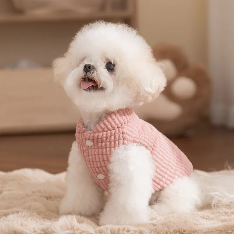 Pink corduroy dog vest with metal leash ring, cotton lining, and bear emblem tag, for small and medium dogs