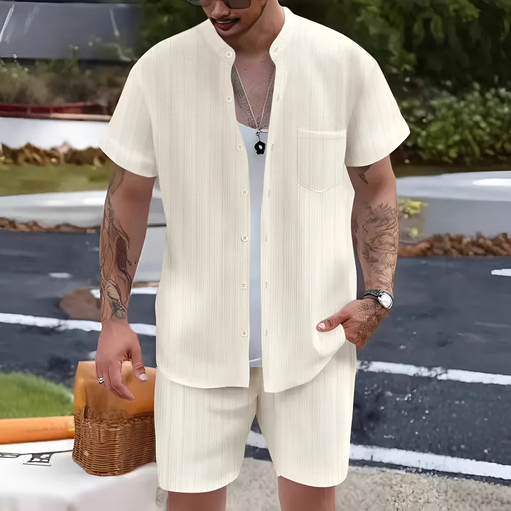 Men's Henry collar short sleeve shirt and shorts set in apricot placed on flat surface