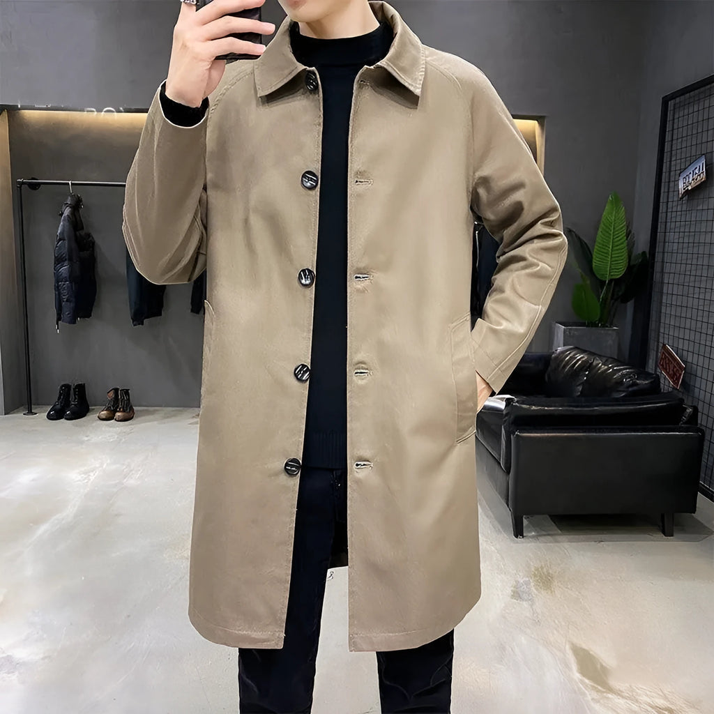 Man wearing a mid-length khaki loose-fit casual trench coat made of rabbit fur.
