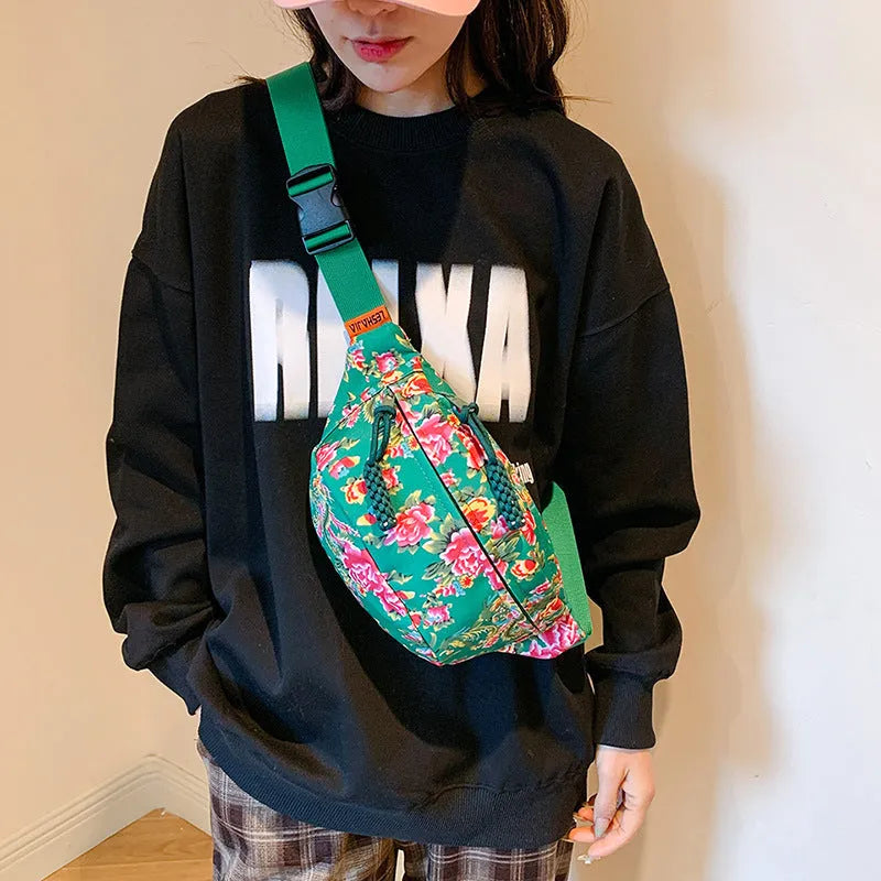 Women's western style waist bag with big flower decoration in black, red, green or blue colours