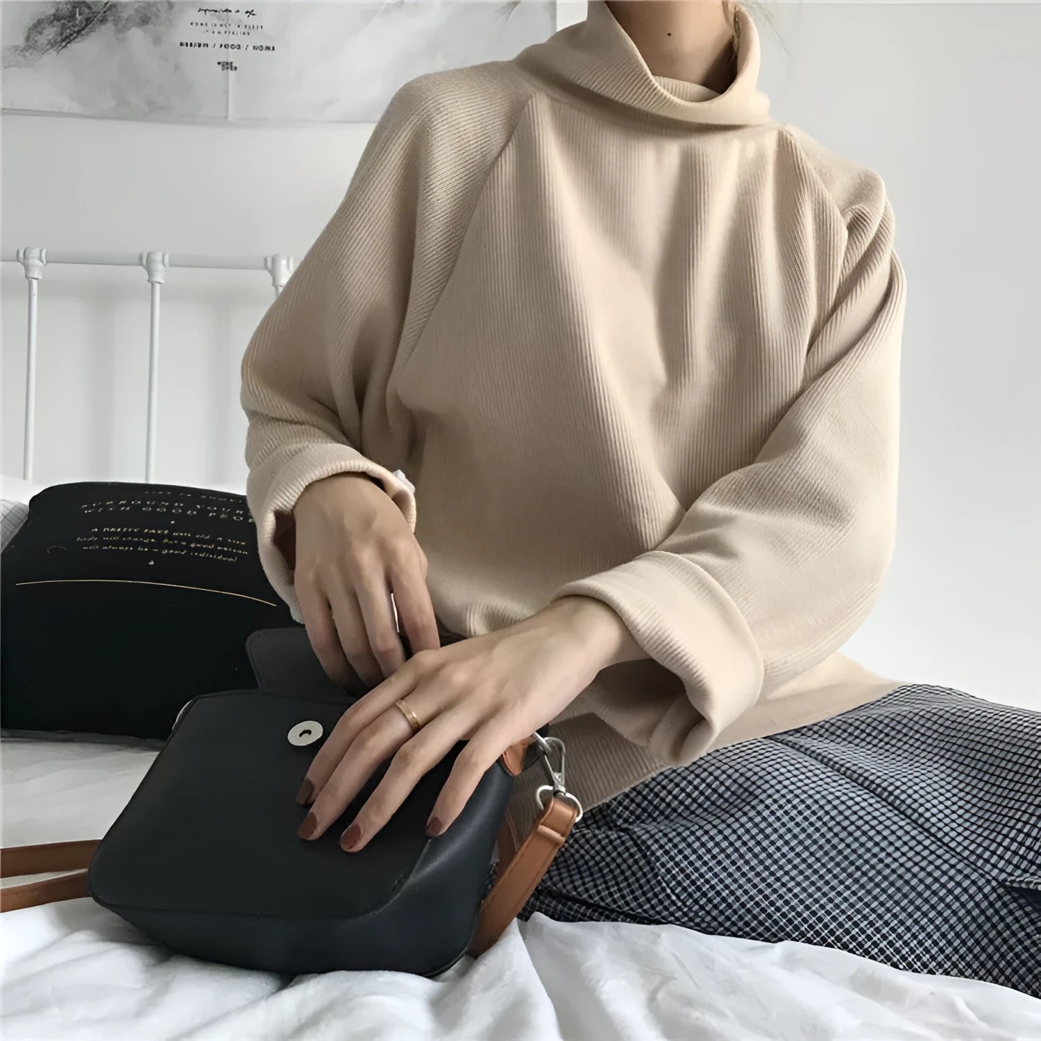 Women's solid colour long sleeve top with half-high collar in loose fit, shown in apricot