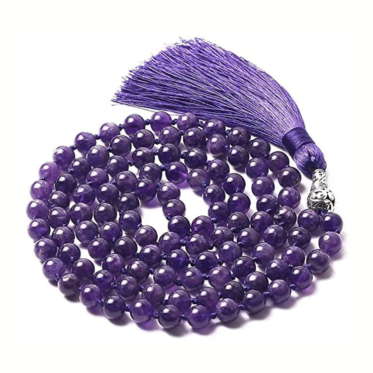 Long agate tassel necklace with geometric beads in multiple natural stone colours on a white background.