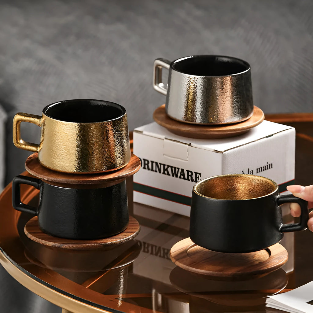 Gold-plated gift tumbler cup and box set on a desk