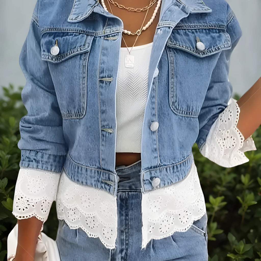 Blue women's denim jacket with white lace stitching on the front, long sleeves.