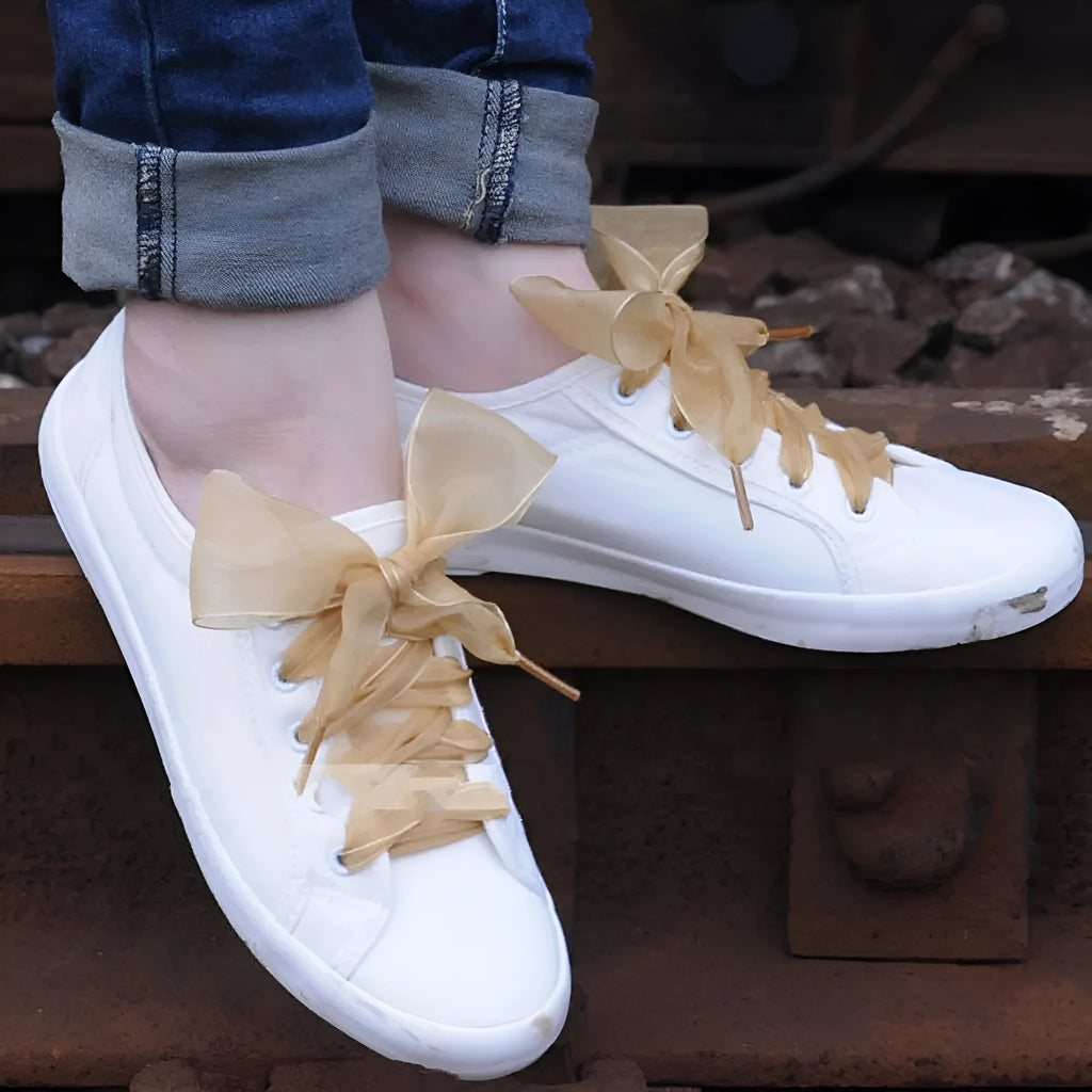 Flat, wide transparent lace shoelaces in multiple colour options on a white background.