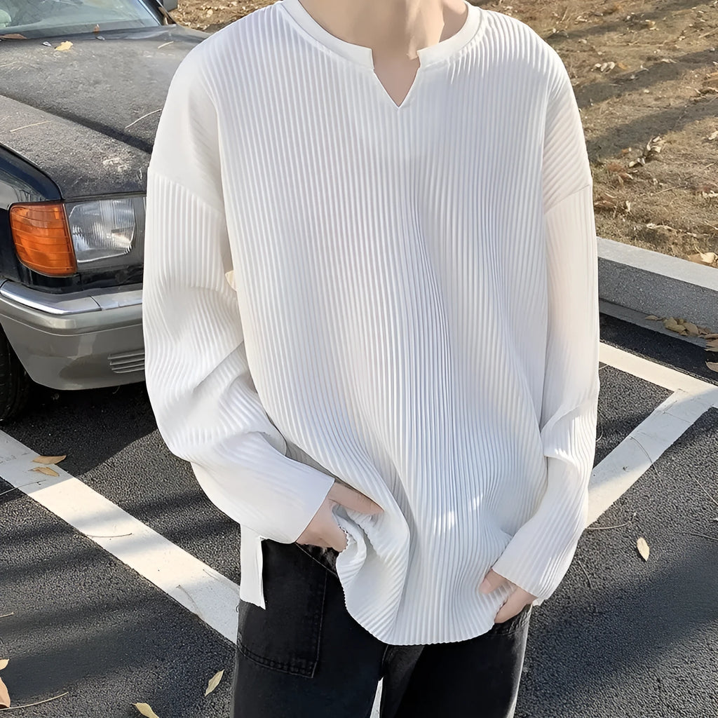 Plus size striped pullover top in black with long sleeves and loose fit