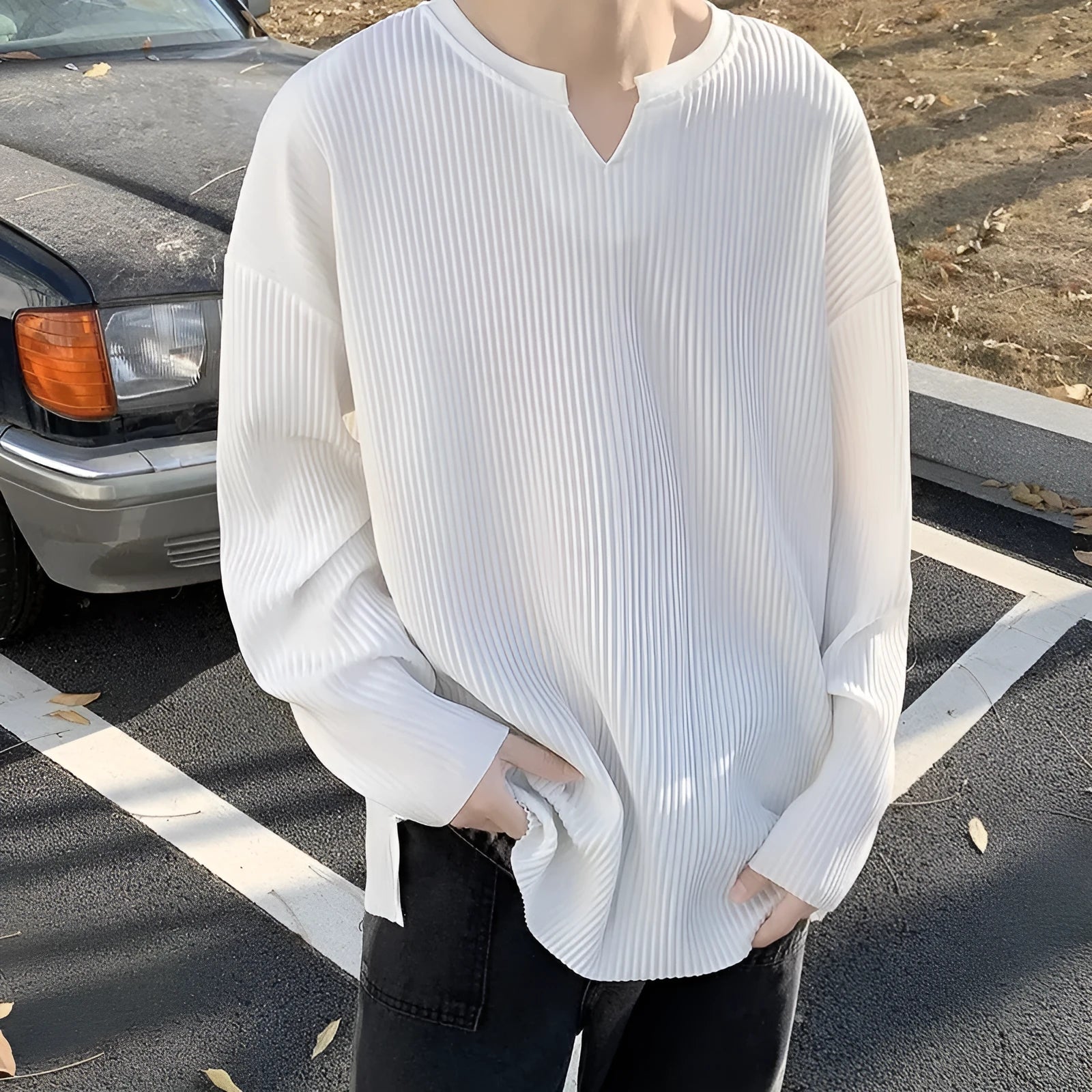 Plus size striped pullover top in black with long sleeves and loose fit