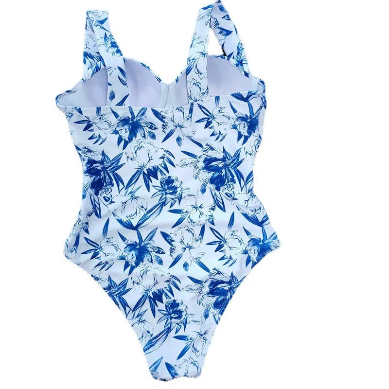 Printed white polyester one-piece swimsuit for ladies with flab hiding design, sleeveless cut