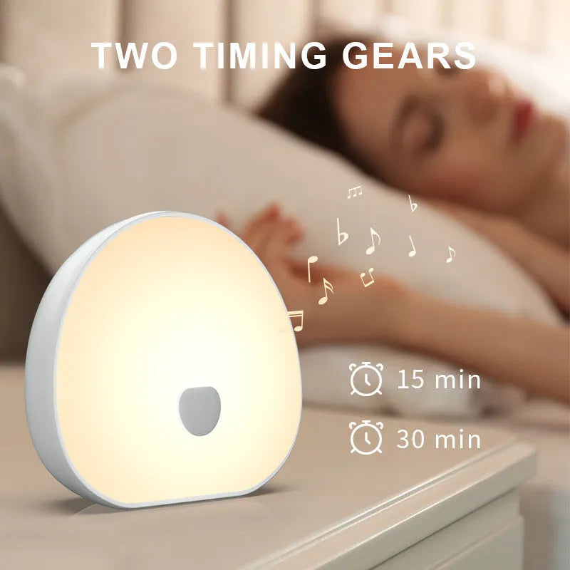 White rechargeable baby feeding comforter with music function for night-time infant care
