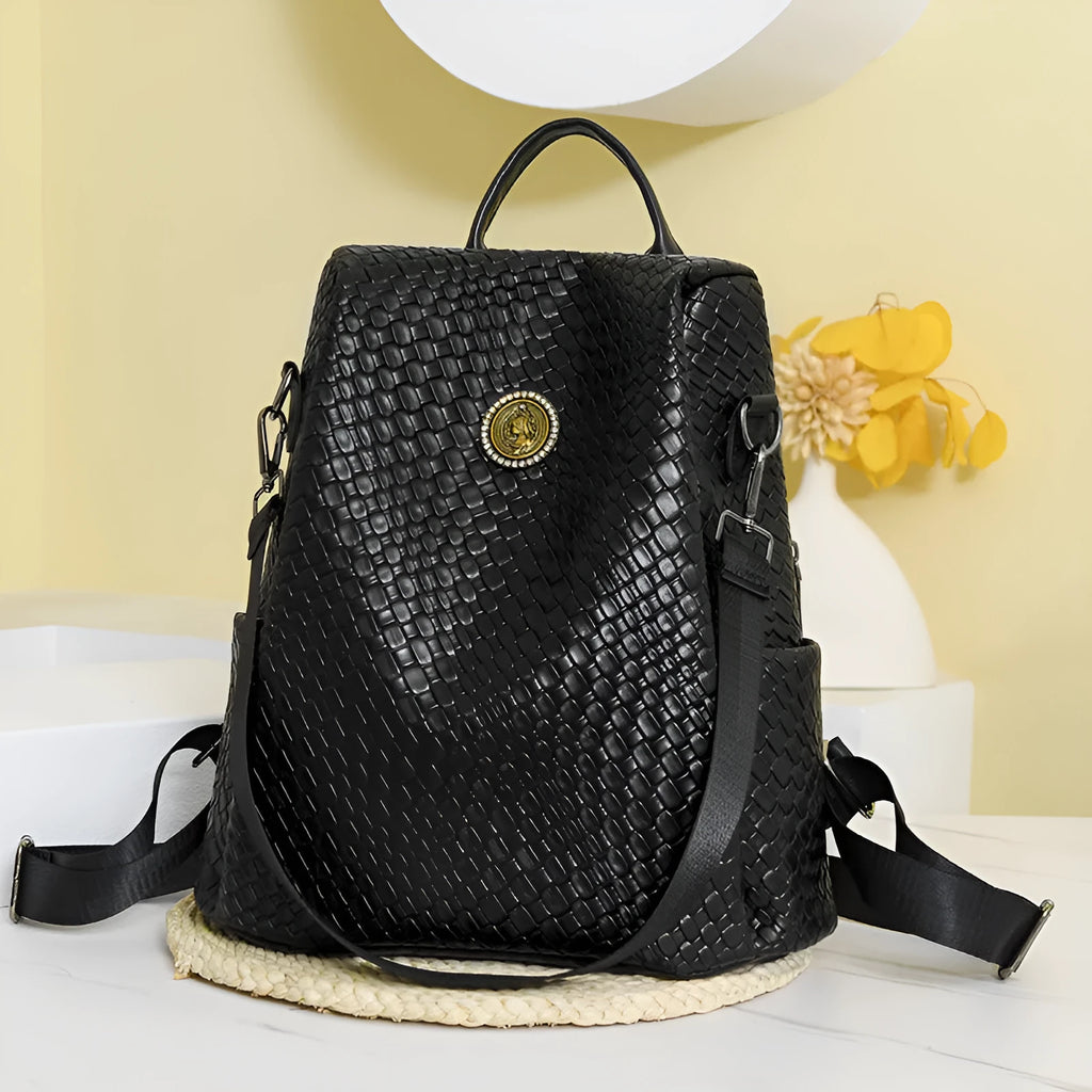 Women's anti-theft backpack in black PU material with multiple compartments and urban styling