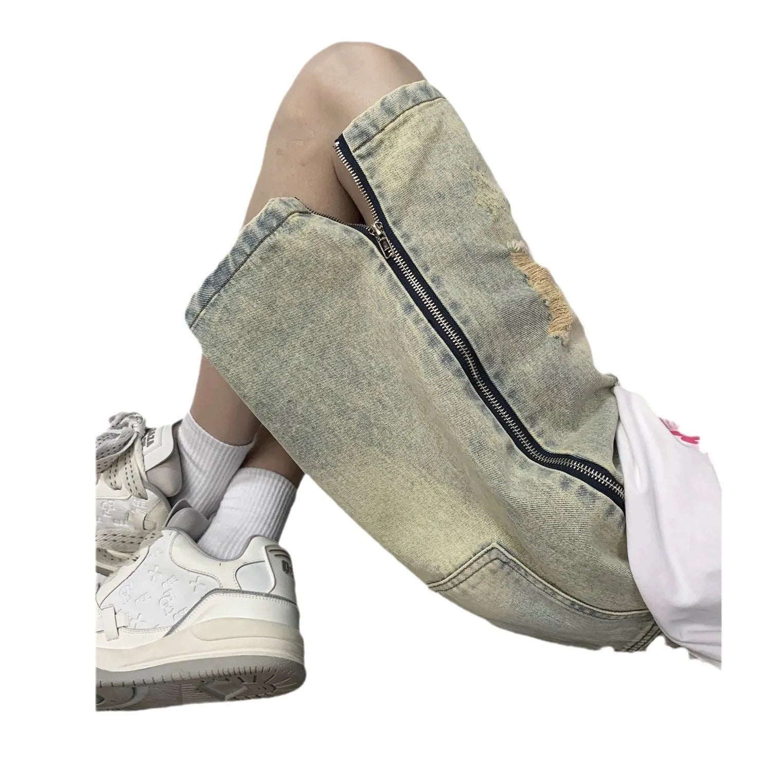 Men's blue denim shorts with mud-wash finish and ripped distressing on a hanger