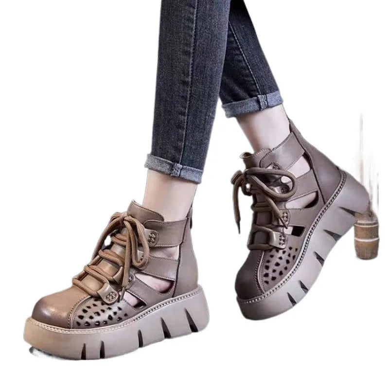 Women's black platform sandals with a hollow hole design and fish mouth toe, made from soft cowhide leather with a PU sole.