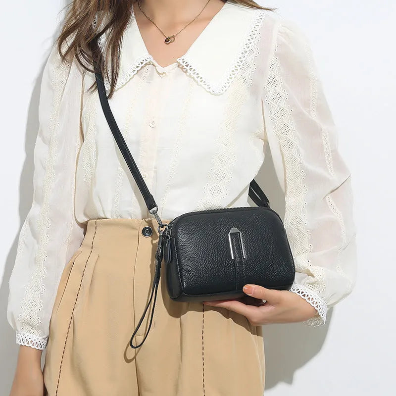 Genuine leather women's shoulder bag in horizontal square shape showing black, navy, green, brown colour options