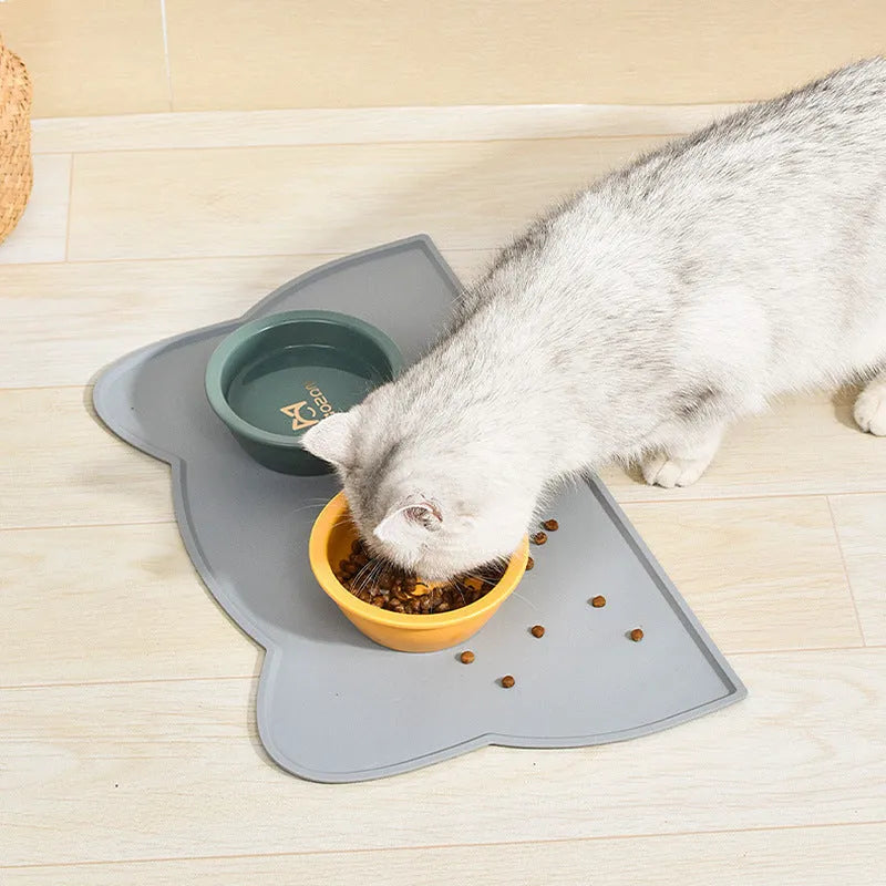 Blue silicone pet feeding mat with cat head design measuring 44cm by 24cm