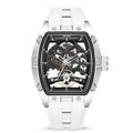 Men's mechanical skeleton watch with hollow dial, steel case, and black silicone band on wrist