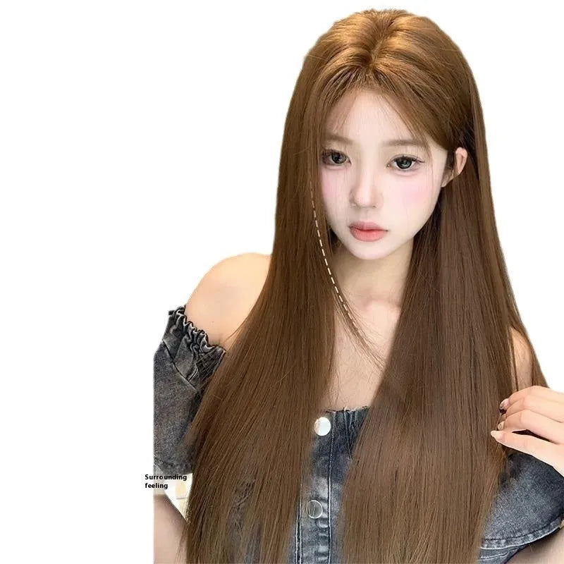 Women's warm brown wig with centre-parted bangs and long straight hair style showing forehead lace detail