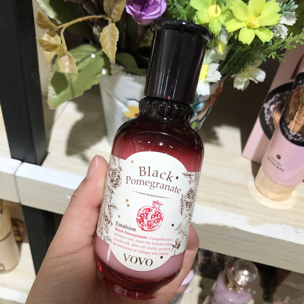 Six-piece pomegranate skincare set showing water, milk, cream, essence, eye cream and cleanser bottles